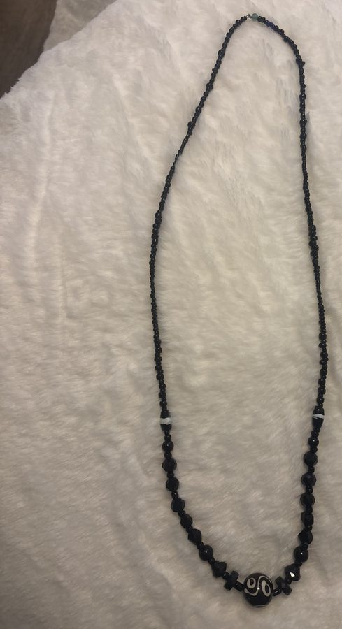 Black glass beaded necklace with patterned agate focal bead
