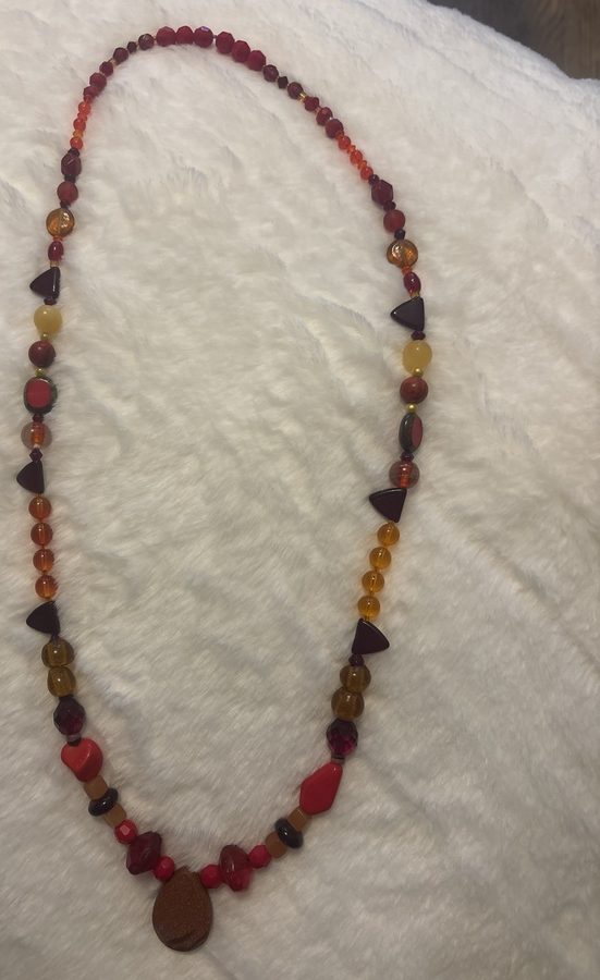 Warm red and amber beaded necklace with pendant