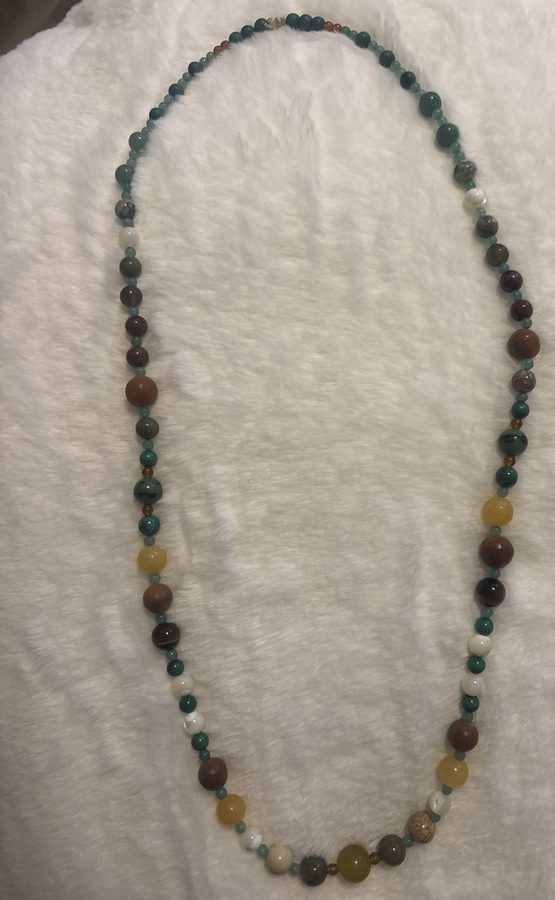 Green, yellow, red, and white earth-toned beaded necklace